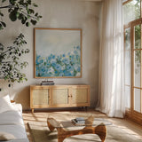 Blooming Landscape Blue by Pamela Munger. Shown in a natural wood frame in a cozy modern living room. Available as an archival giclee rolled canvas, fine art paper, or poster print. SKU 82088a.