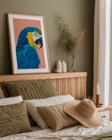 Blue and Gold Macaw Crop by Pamela Munger. shown as a paper print in a natural frame. Available as a archival giclee rolled canvas, fine art paper, or poster print. SKU 69770h.