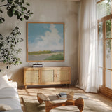 Clouds Over Lagoon by Pamela Munger. Shown in a natural wood frame in a cozy modern living room. Available as an archival giclee rolled canvas, fine art paper, or poster print. SKU 71697a.