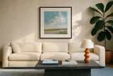 Clouds Over Lagoon by Pamela Munger. Displayed in a glass frame with matte in a clean modern living room. Available as an archival giclee rolled canvas, fine art paper, or poster print. SKU 71697a.