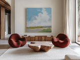 Clouds Over Lagoon by Pamela Munger. Shown as extra-large giant wall art in a modern living room. Available as an archival giclee rolled canvas, fine art paper, or poster print. SKU 71697a.