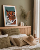 Colorful Tiger on Teal by Pamela Munger. shown as a paper print in a natural frame. Available as a archival giclee rolled canvas, fine art paper, or poster print. SKU 72817h.