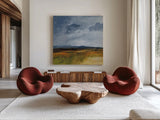 Storm Over Buckhorn by Pamela Munger. Shown as extra-large giant wall art in a modern living room. Available as an archival giclee rolled canvas, fine art paper, or poster print. SKU 87348a.