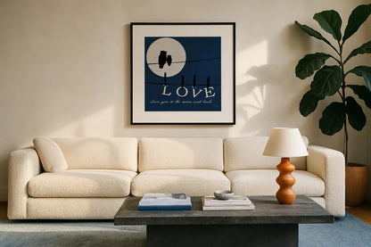 Moon Love I Indigo by Pela. Displayed in a glass frame with matte in a clean modern living room. Available as an archival giclee rolled canvas, fine art paper, or poster print. SKU 49854a.