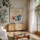 Ocean Life IX by Pela. Shown in a natural wood frame in a cozy modern living room. Available as an archival giclee rolled canvas, fine art paper, or poster print. SKU 104775a.