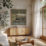 A Great Journey XII by Pela Studio. Shown in a natural wood frame in a cozy modern living room. Available as an archival giclee rolled canvas, fine art paper, or poster print. SKU 20651a.