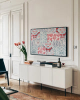 Bazaar Patchwork I by Pela Studio. shown as a framed stretched canvas in a living room above a console. Available as a archival giclee rolled canvas, fine art paper, or poster print. SKU 48748i.