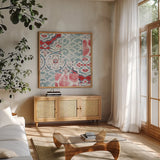 Bazaar Patchwork II by Pela Studio. Shown in a natural wood frame in a cozy modern living room. Available as an archival giclee rolled canvas, fine art paper, or poster print. SKU 48749a.