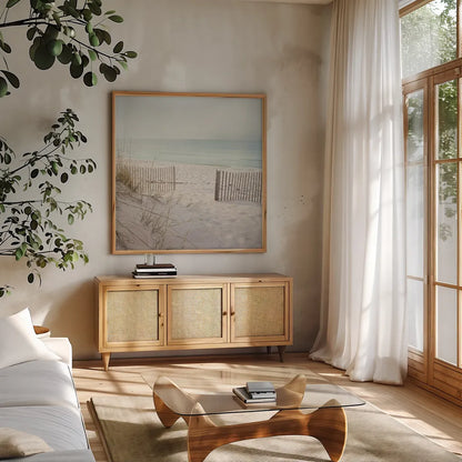 Beach Fence by Pela Studio. Shown in a natural wood frame in a cozy modern living room. Available as an archival giclee rolled canvas, fine art paper, or poster print. SKU 76252a.