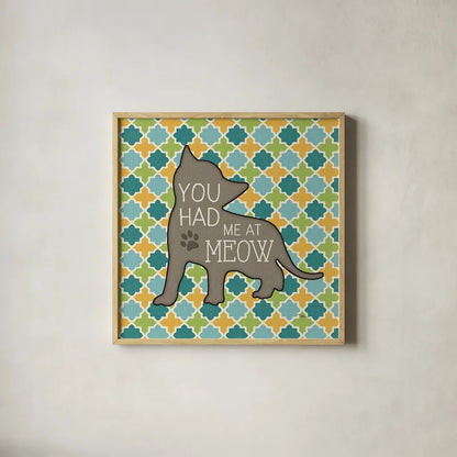 Cat Sayin II by Pela Studio. Shown in a natural wood glass frame for a timeless modern aesthetic. Available as an archival giclee rolled canvas, fine art paper, or poster print. SKU 14297a.