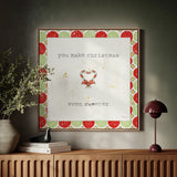 Christmas Cuties II Step 01A by Pela Studio. Displayed as framed wall art above a natural console on a Venetian plaster wall. Available as an archival giclee rolled canvas, fine art paper, or poster print. SKU 47512a.