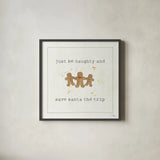 Christmas Cuties VI - Just be Naughty and Save Santa the Trip by Pela Studio. Shown in a sleek black glass frame for a contemporary gallery look. Available as an archival giclee rolled canvas, fine art paper, or poster print. SKU 30849a.
