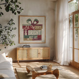 Christmas Signs I by Pela Studio. Shown in a natural wood frame in a cozy modern living room. Available as an archival giclee rolled canvas, fine art paper, or poster print. SKU 36671a.