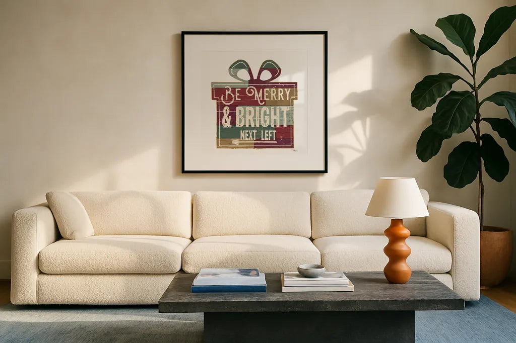 Christmas Signs I White by Pela Studio. Displayed in a glass frame with matte in a clean modern living room. Available as an archival giclee rolled canvas, fine art paper, or poster print. SKU 65491a.