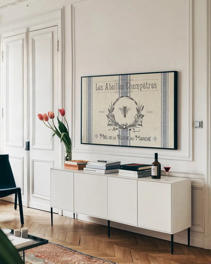 French Farmhouse I by Pela Studio. shown as a framed stretched canvas in a living room above a console. Available as a archival giclee rolled canvas, fine art paper, or poster print. SKU 45584i.