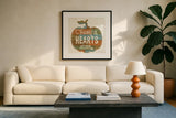 Harvest Signs I by Pela Studio. Displayed in a glass frame with matte in a clean modern living room. Available as an archival giclee rolled canvas, fine art paper, or poster print. SKU 35218a.