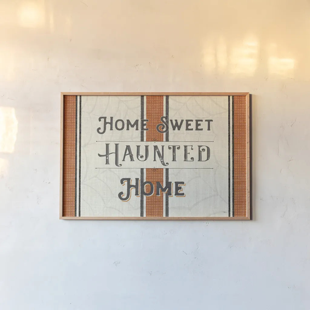 Home Sweet Haunted Home by Pela Studio. shown as a paper print in a natural frame. Available as a archival giclee rolled canvas, fine art paper, or poster print. SKU 57875i.