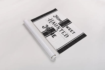 Home Sweet Haunted Home BW by Pela Studio. shown as a rolled paper print. Available as archival giclee rolled canvas, fine art paper, or poster print. SKU 68426i.