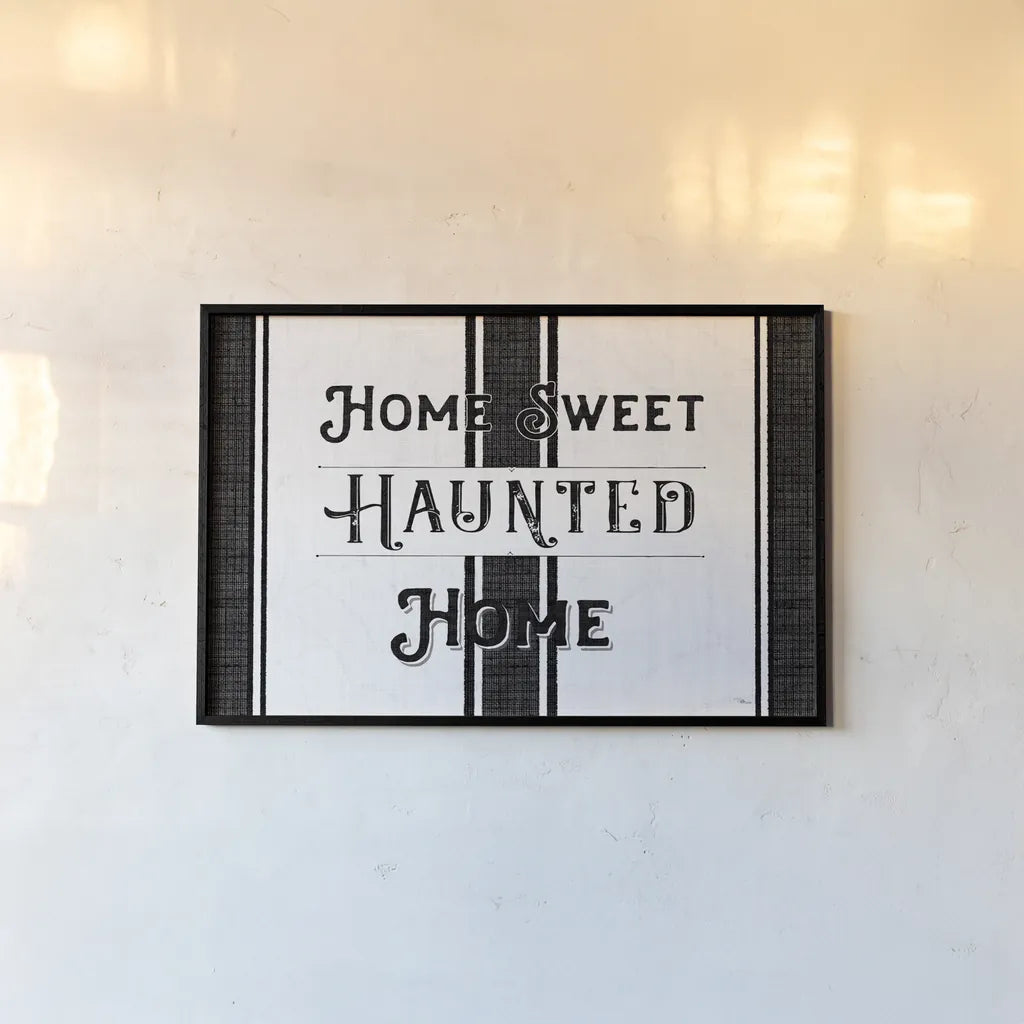 Home Sweet Haunted Home BW by Pela Studio. shown as a paper print in a black flame. Available as a archival giclee rolled canvas, fine art paper, or poster print. SKU 68426i.