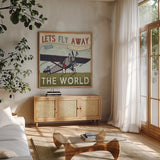 Lets Travel II by Pela Studio. Shown in a natural wood frame in a cozy modern living room. Available as an archival giclee rolled canvas, fine art paper, or poster print. SKU 10862a.