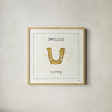 Lil Memos Feeling Lucky by Pela Studio. Shown in a natural wood glass frame for a timeless modern aesthetic. Available as an archival giclee rolled canvas, fine art paper, or poster print. SKU 28479a.