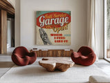 Mancave I - Full Service Garage by Pela Studio. Shown as extra-large giant wall art in a modern living room. Available as an archival giclee rolled canvas, fine art paper, or poster print. SKU 10311a.