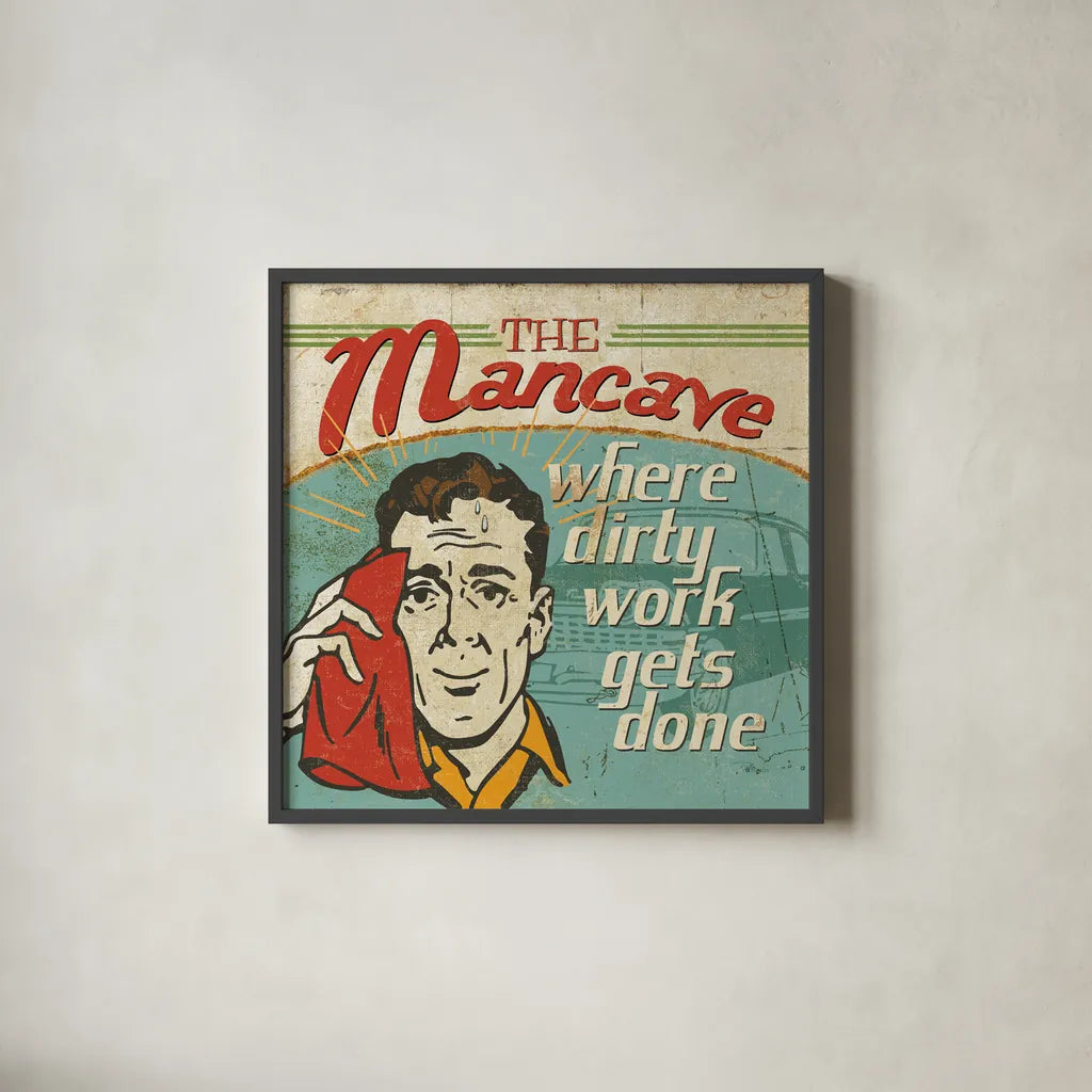 Mancave III - Where Dirty Work Gets Done by Pela Studio. Shown in a sleek black glass frame for a contemporary gallery look. Available as an archival giclee rolled canvas, fine art paper, or poster print. SKU 10313a.