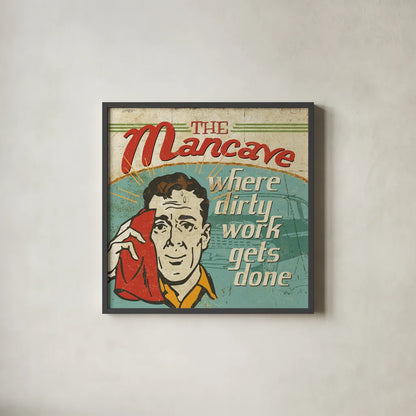 Mancave III - Where Dirty Work Gets Done by Pela Studio. Shown in a sleek black glass frame for a contemporary gallery look. Available as an archival giclee rolled canvas, fine art paper, or poster print. SKU 10313a.