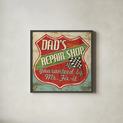 Mancave IV -  Dads Repair Shop by Pela Studio. Shown in a sleek black glass frame for a contemporary gallery look. Available as an archival giclee rolled canvas, fine art paper, or poster print. SKU 10314a.