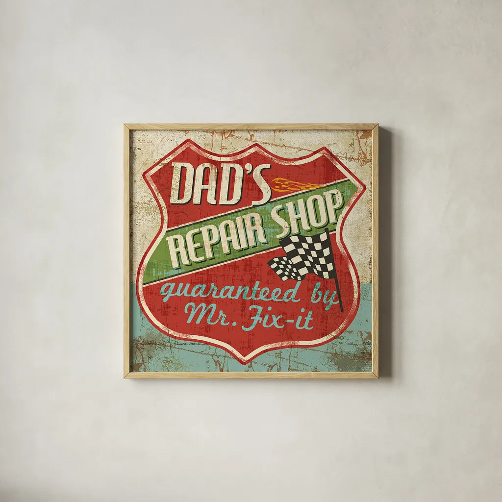 Mancave IV -  Dads Repair Shop by Pela Studio. Shown in a natural wood glass frame for a timeless modern aesthetic. Available as an archival giclee rolled canvas, fine art paper, or poster print. SKU 10314a.