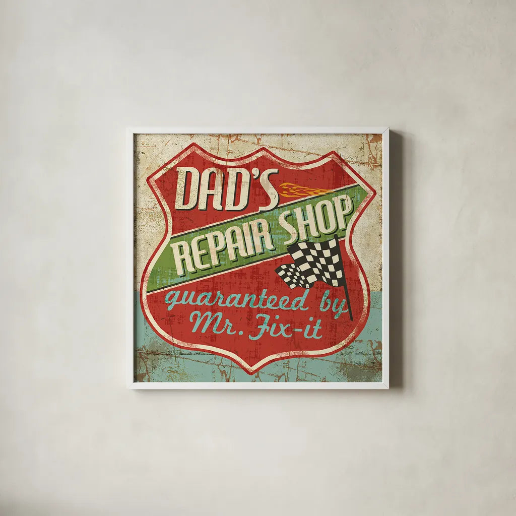 Mancave IV -  Dads Repair Shop by Pela Studio. Shown in a crisp white glass frame for a clean and minimalist style. Available as an archival giclee rolled canvas, fine art paper, or poster print. SKU 10314a.