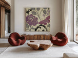 Perfect Petals I Lavender by Pela Studio. Shown as extra-large giant wall art in a modern living room. Available as an archival giclee rolled canvas, fine art paper, or poster print. SKU 13169a.