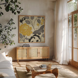 Perfect Petals I Yellow by Pela Studio. Shown in a natural wood frame in a cozy modern living room. Available as an archival giclee rolled canvas, fine art paper, or poster print. SKU 13285a.