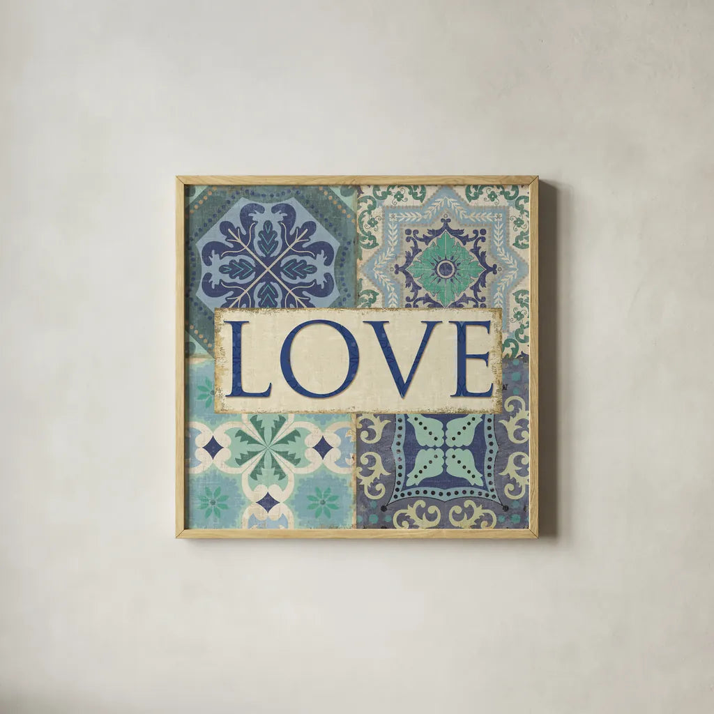 Santorini I Love by Pela Studio. Shown in a natural wood glass frame for a timeless modern aesthetic. Available as an archival giclee rolled canvas, fine art paper, or poster print. SKU 12150a.