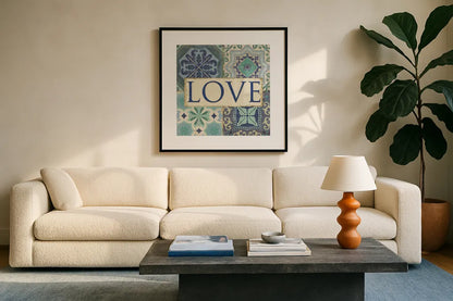 Santorini I Love by Pela Studio. Displayed in a glass frame with matte in a clean modern living room. Available as an archival giclee rolled canvas, fine art paper, or poster print. SKU 12150a.