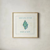 Sea Treasures VI - Love you to the Beach and Back by Pela Studio. Shown in a natural wood glass frame for a timeless modern aesthetic. Available as an archival giclee rolled canvas, fine art paper, or poster print. SKU 46974a.