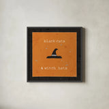 Spooky Cuties II Witch Hats by Pela Studio. Shown in a sleek black glass frame for a contemporary gallery look. Available as an archival giclee rolled canvas, fine art paper, or poster print. SKU 47584a.