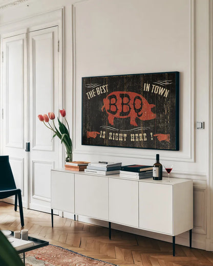 The Best BBQ in Town by Pela Studio. shown as a framed stretched canvas in a living room above a console. Available as a archival giclee rolled canvas, fine art paper, or poster print. SKU 11735i.