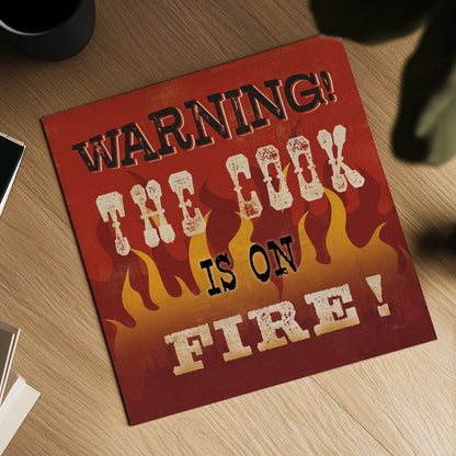 The Cook is On Fire by Pela Studio. Shown as a detailed flat fine art print, highlighting archival giclee quality. Available as an archival giclee rolled canvas, fine art paper, or poster print. SKU 92148a.