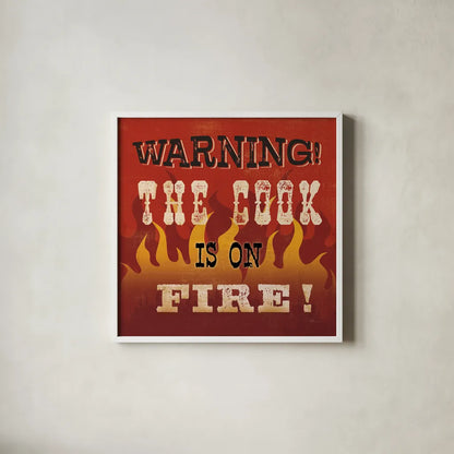 The Cook is On Fire by Pela Studio. Shown in a crisp white glass frame for a clean and minimalist style. Available as an archival giclee rolled canvas, fine art paper, or poster print. SKU 92148a.