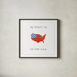 USA Cuties II on White by Pela Studio. Shown in a sleek black glass frame for a contemporary gallery look. Available as an archival giclee rolled canvas, fine art paper, or poster print. SKU 28564a.
