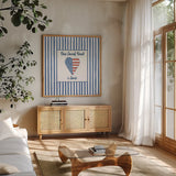 USA Cuties Stripes III by Pela Studio. Shown in a natural wood frame in a cozy modern living room. Available as an archival giclee rolled canvas, fine art paper, or poster print. SKU 98930a.