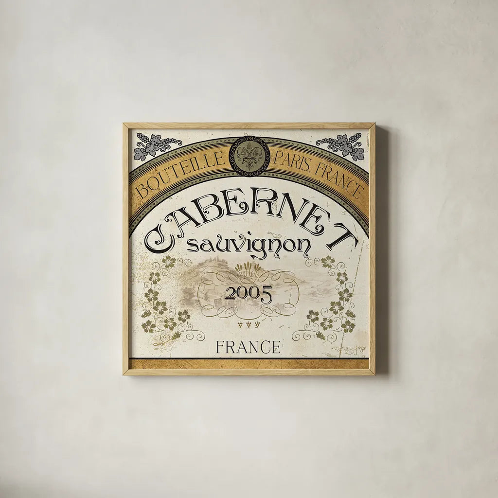 Wine Labels I by Pela Studio. Shown in a natural wood glass frame for a timeless modern aesthetic. Available as an archival giclee rolled canvas, fine art paper, or poster print. SKU 12859a.