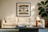 Wine Labels II by Pela Studio. Displayed in a glass frame with matte in a clean modern living room. Available as an archival giclee rolled canvas, fine art paper, or poster print. SKU 12860a.