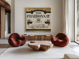 Wine Labels II by Pela Studio. Shown as extra-large giant wall art in a modern living room. Available as an archival giclee rolled canvas, fine art paper, or poster print. SKU 12860a.