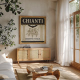 Wine Labels III by Pela Studio. Shown in a natural wood frame in a cozy modern living room. Available as an archival giclee rolled canvas, fine art paper, or poster print. SKU 12861a.