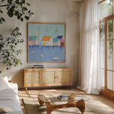 Boat House Row by Phyllis Adams. Shown in a natural wood frame in a cozy modern living room. Available as an archival giclee rolled canvas, fine art paper, or poster print. SKU 27250a.