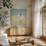 Colorful Sheep by Phyllis Adams. Shown in a natural wood frame in a cozy modern living room. Available as an archival giclee rolled canvas, fine art paper, or poster print. SKU 61809a.