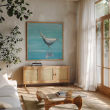 Egret I Bright by Phyllis Adams. Shown in a natural wood frame in a cozy modern living room. Available as an archival giclee rolled canvas, fine art paper, or poster print. SKU 27681a.