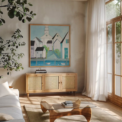 Harbor Town III No Sign Light by Phyllis Adams. Shown in a natural wood frame in a cozy modern living room. Available as an archival giclee rolled canvas, fine art paper, or poster print. SKU 52860a.
